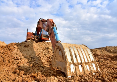 A machine digging up earth during Excavation Services in Pekin IL