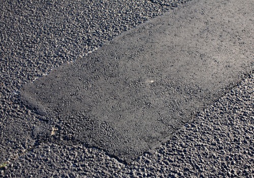 repaired asphalt on road