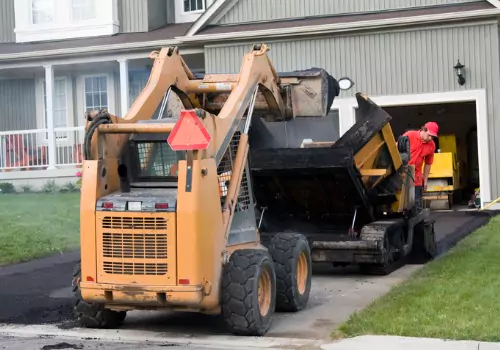 A truck loading asphalt during a job for Asphalt Paving in Bloomington IL